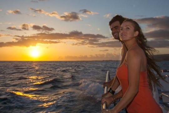 Couple on boat during sunset
